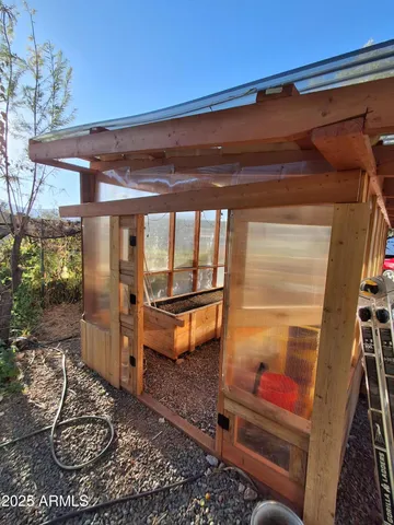 a room with wooden floor and furniture