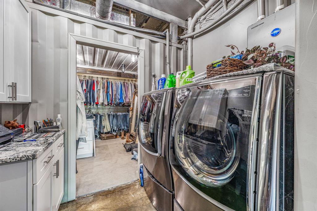 886 Mitchell Hill Road Gordon, TX 76453 - Photo 12 of 34 a view of a storage and utility room with washer and dryer
