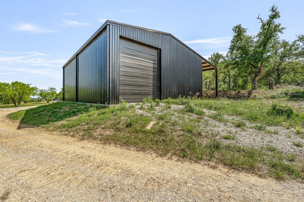 886 Mitchell Hill Road Gordon, TX 76453 - Photo 17 of 34 a backyard of a house