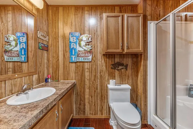 a kitchen with stainless steel appliances granite countertop a refrigerator a stove and a sink