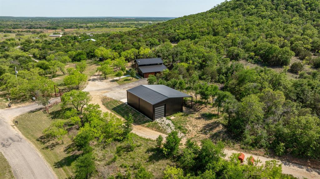 886 Mitchell Hill Road Gordon, TX 76453 - Photo 28 of 34 a view of a garden with lawn chairs