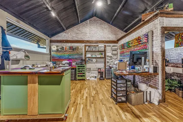 a living room filled with furniture and a potted plant
