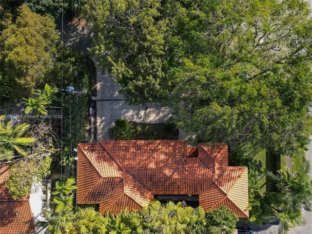 an aerial view of a house with an outdoor space