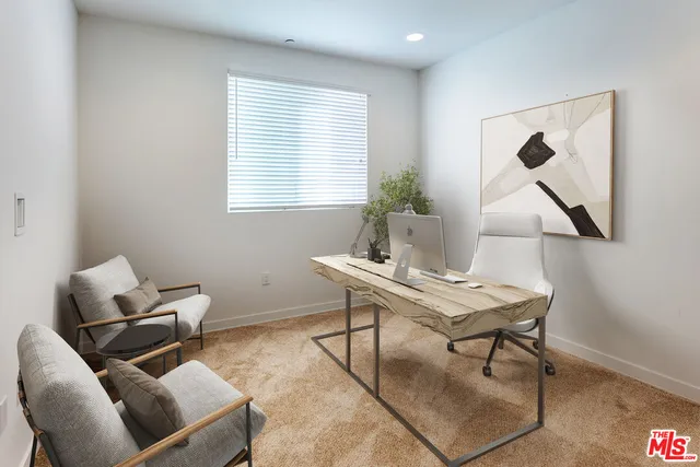 a work room with furniture and window