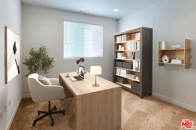 a workspace with furniture and window