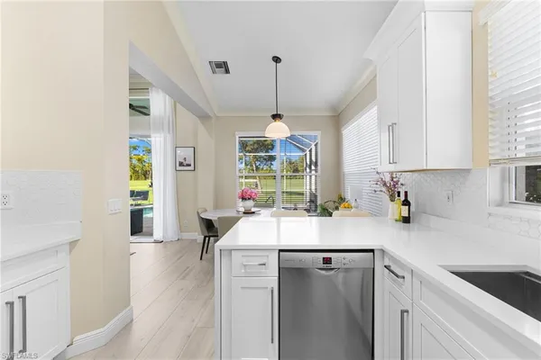 a kitchen with counter top space and window
