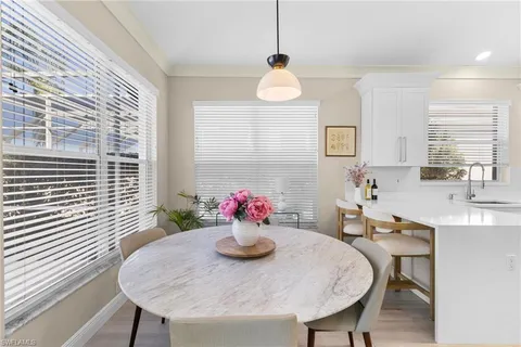 a kitchen with a table and chairs in it
