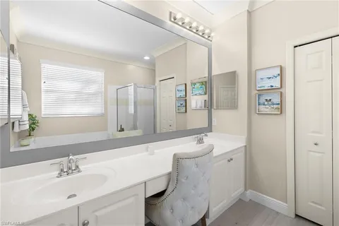 a bathroom with a double vanity sink mirror and double