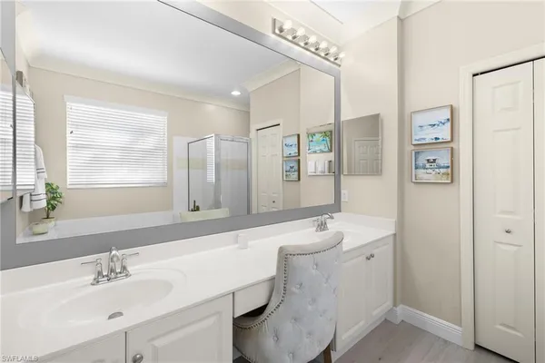 a bathroom with a double vanity sink mirror and double