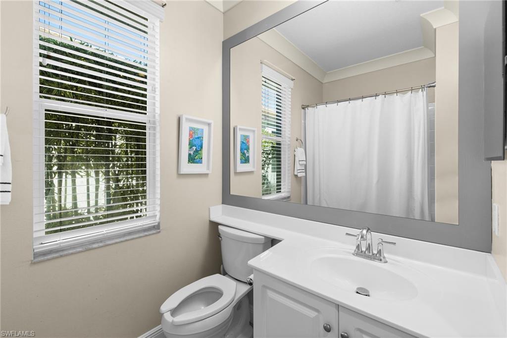 1869 Pondside Lane Naples, FL 34109 - Photo 23 of 34 Full bathroom with a shower with curtain, vanity, and crown molding