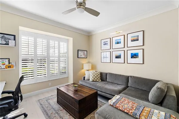 a living room with furniture and a window