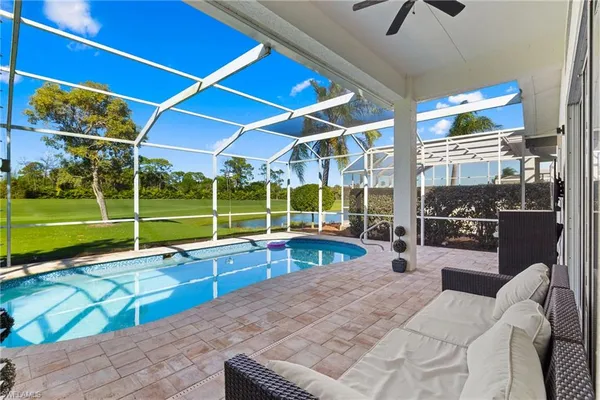 a view of a patio with a table and chairs