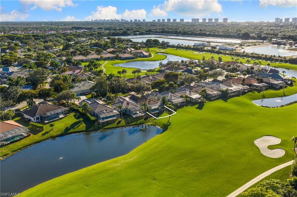 1869 Pondside Lane Naples, FL 34109 - Photo 31 of 34 Aerial perspective of suburban area featuring a large body of water and skyline