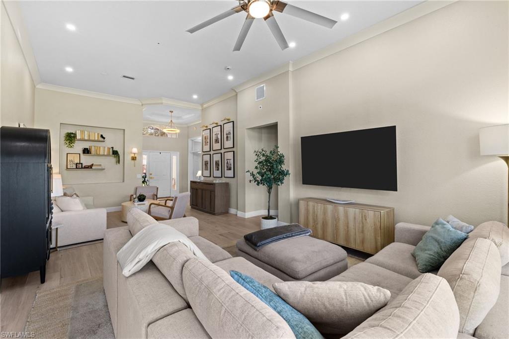 1869 Pondside Lane Naples, FL 34109 - Photo 7 of 34 Living room featuring light wood-style flooring, ornamental molding, ceiling fan, and recessed lighting