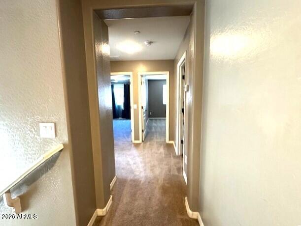3827 East Trigger Way Gilbert, AZ 85297 - Photo 14 of 41 a view of a hallway with wooden floor
