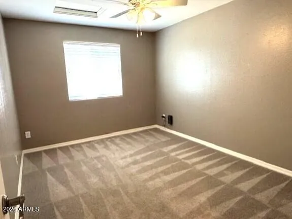 a white toilet sitting next to a small bathroom