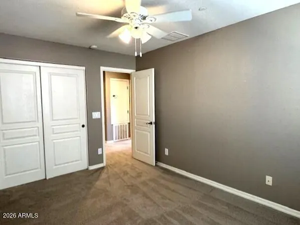a bathroom with a glass door shower and vanity