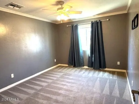 a view of a livingroom with a ceiling fan and window