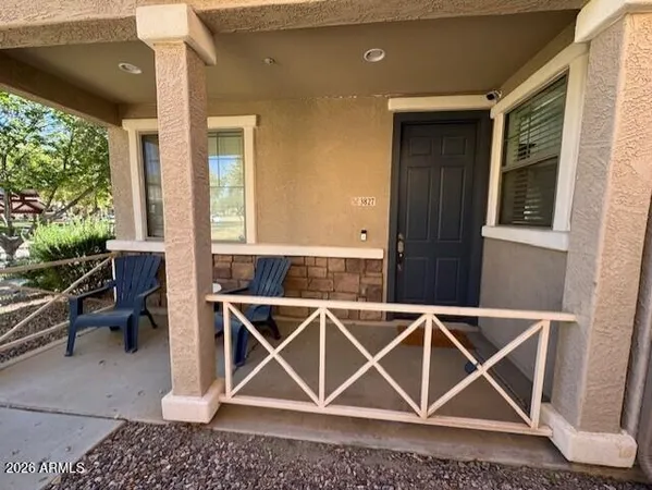 a view of a swimming pool with a patio and a yard