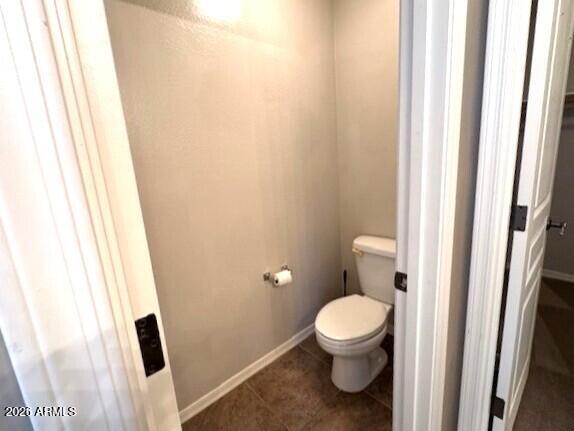 3827 East Trigger Way Gilbert, AZ 85297 - Photo 27 of 41 a white toilet sitting next to a small bathroom