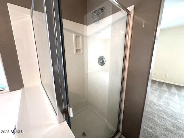 3827 East Trigger Way Gilbert, AZ 85297 - Photo 28 of 41 a bathroom with a glass door shower and vanity