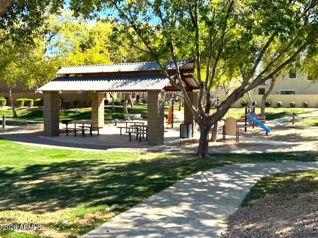 3827 East Trigger Way Gilbert, AZ 85297 - Photo 3 of 41 a view of a swimming pool with a patio and a yard