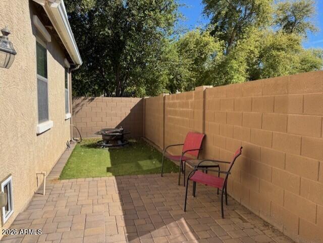 3827 East Trigger Way Gilbert, AZ 85297 - Photo 37 of 41 a view of backyard with outdoor seating and barbeque oven