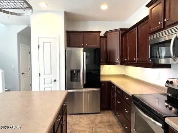 a utility room with closet dryer and washer