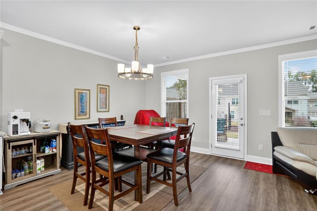 2805 Harmony Trail Road Atlanta, GA 30360 - Photo 11 of 23 a view of a dining room with furniture window and wooden floor