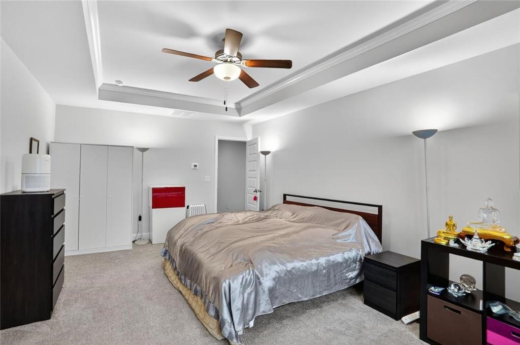 2805 Harmony Trail Road Atlanta, GA 30360 - Photo 13 of 23 a bedroom with a bed and a chandelier