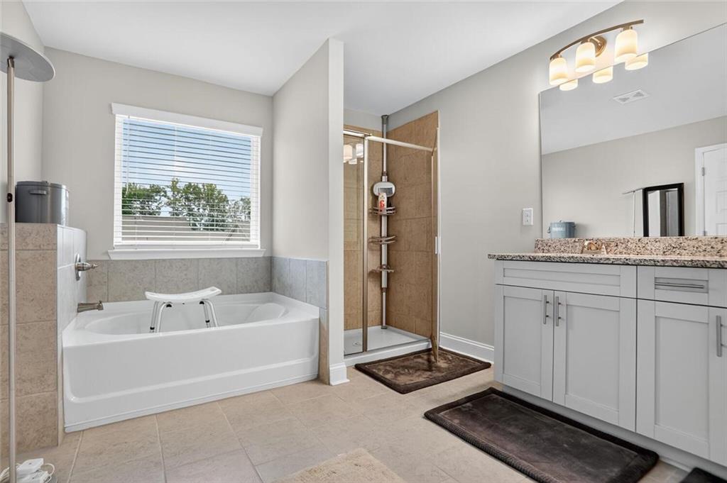 2805 Harmony Trail Road Atlanta, GA 30360 - Photo 15 of 23 a bathroom with a tub a sink and a window