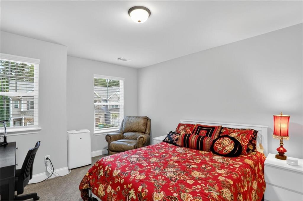 2805 Harmony Trail Road Atlanta, GA 30360 - Photo 16 of 23 a bedroom with a bed and wooden floor