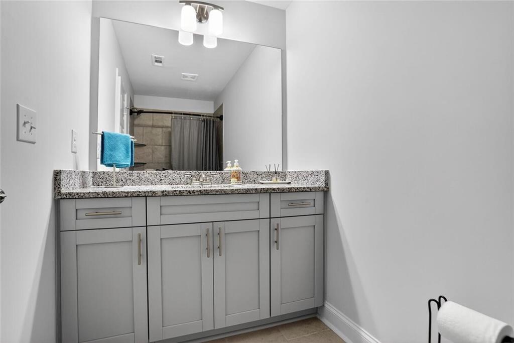 2805 Harmony Trail Road Atlanta, GA 30360 - Photo 17 of 23 a bathroom with a sink and a mirror