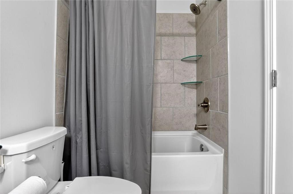 2805 Harmony Trail Road Atlanta, GA 30360 - Photo 18 of 23 a white toilet sitting next to a bathroom sink