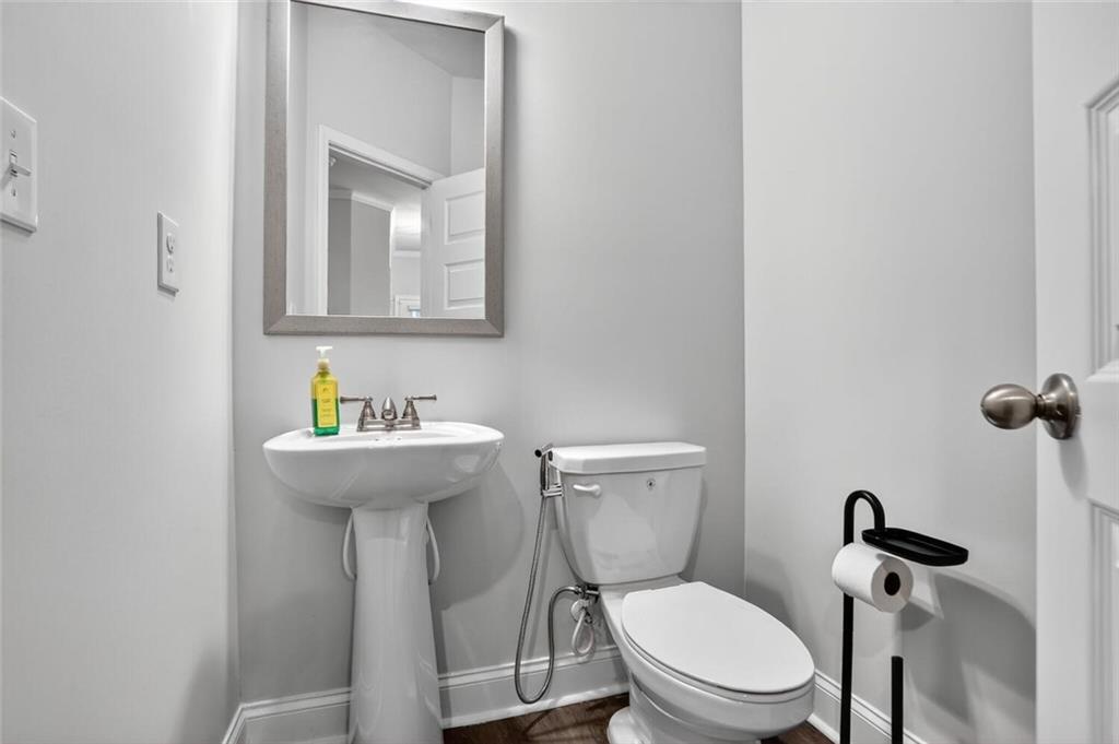 2805 Harmony Trail Road Atlanta, GA 30360 - Photo 6 of 23 a bathroom with a toilet sink and mirror
