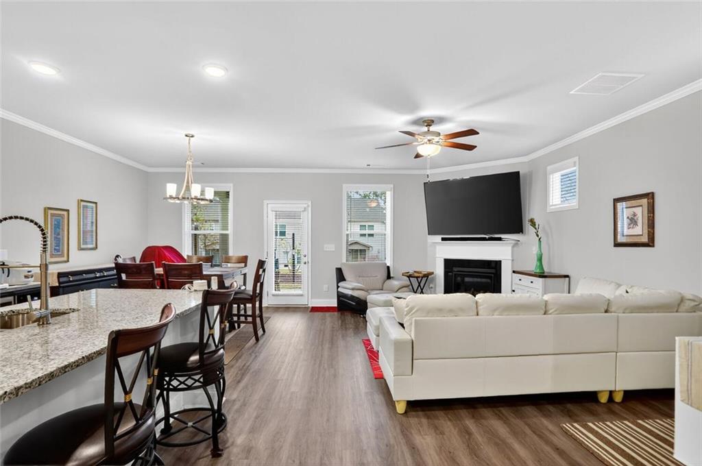 2805 Harmony Trail Road Atlanta, GA 30360 - Photo 7 of 23 a living room with furniture a fireplace and a flat screen tv