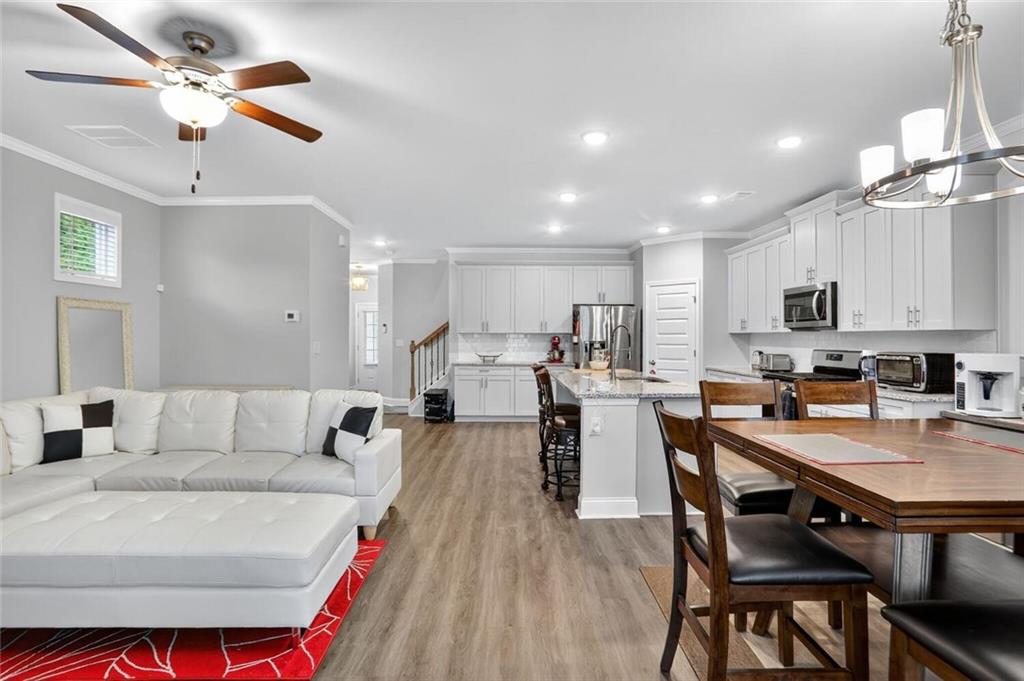 2805 Harmony Trail Road Atlanta, GA 30360 - Photo 9 of 23 a living room with stainless steel appliances furniture a dining table and kitchen view