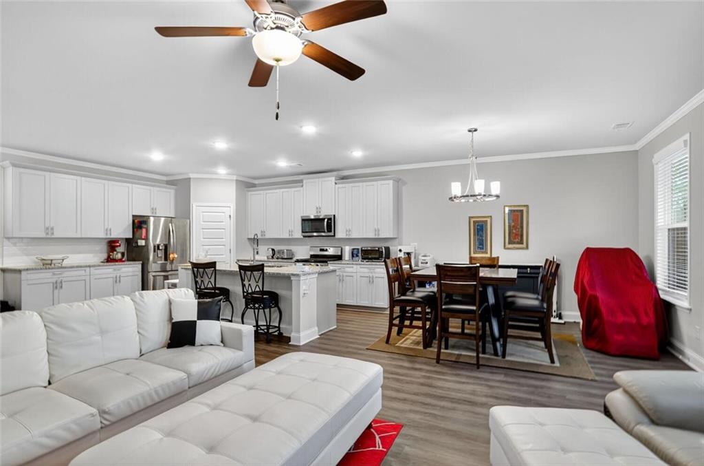2805 Harmony Trail Road Atlanta, GA 30360 - Photo 10 of 23 a living room with furniture kitchen view and a chandelier