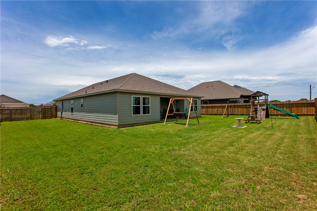 137 Windmill Road Somerville, TX 77879 - Photo 16 of 17 a front view of a house with a garden