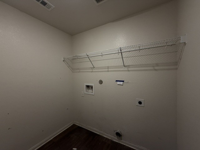 124 Niven Path Jarrell, TX 76537 - Photo 13 of 15 a view of a room with racks on the wall