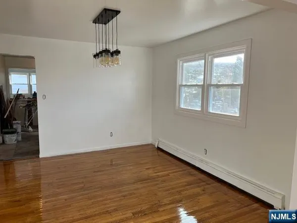 a kitchen with stainless steel appliances granite countertop a refrigerator stove and sink