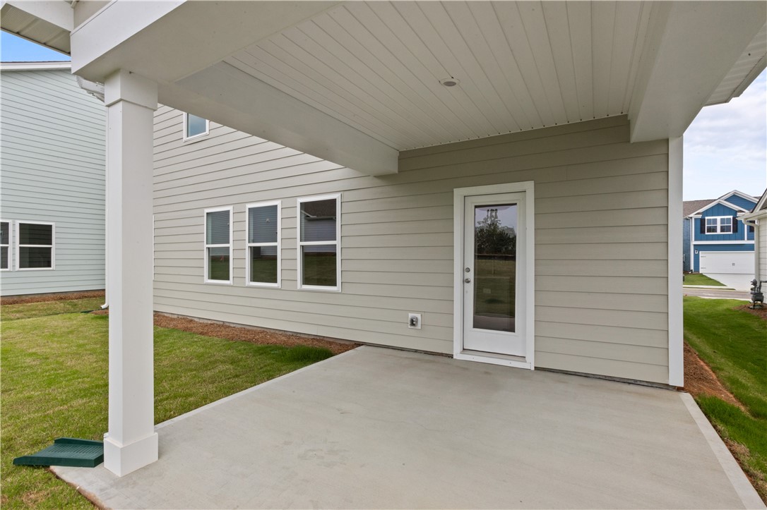 555 Hydrangea Street, Unit LOT 47 Seneca, SC 29678 - Photo 6 of 38 An inviting covered patio offers seamless indoor-outdoor living, perfect for relaxation or entertaining.