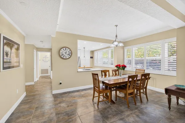 a kitchen with a sink and white cabinets