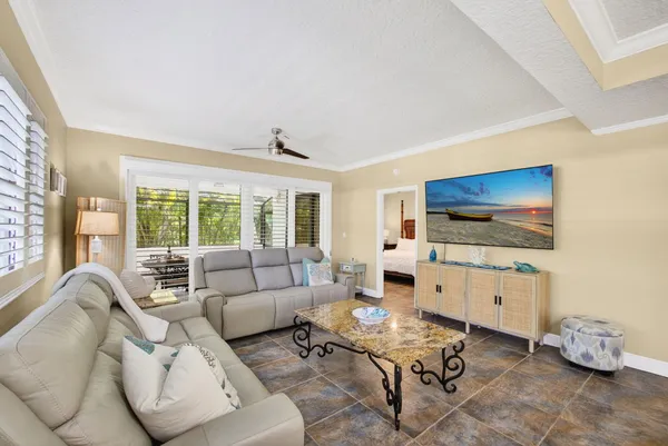 a kitchen with stainless steel appliances kitchen island a refrigerator sink and stove