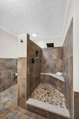 an aerial view of residential houses with outdoor space and street view