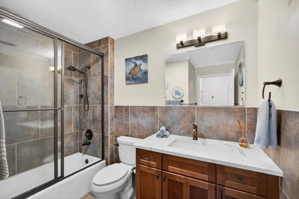 a view of a yard with plants and outdoor seating