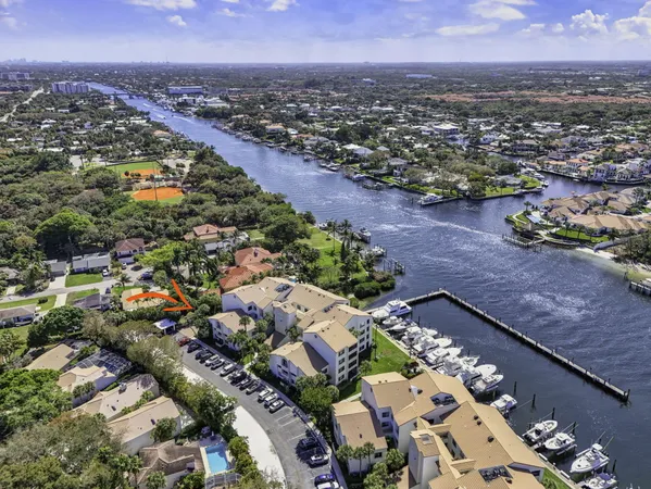 an aerial view of residential houses with outdoor space and street view