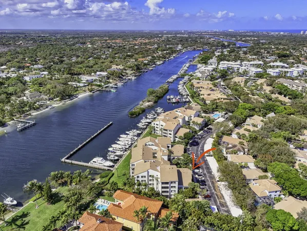 an aerial view of a house with a ocean view