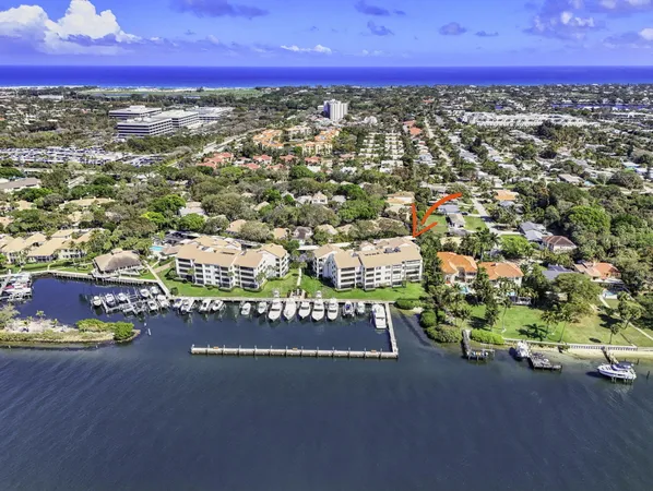 a view of a house with backyard patio and sitting area