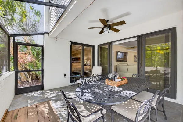 a view of a dining room with furniture and window